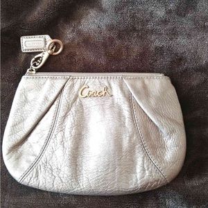 Coach cosmetic pouch in rose gold theater. Good used condition.